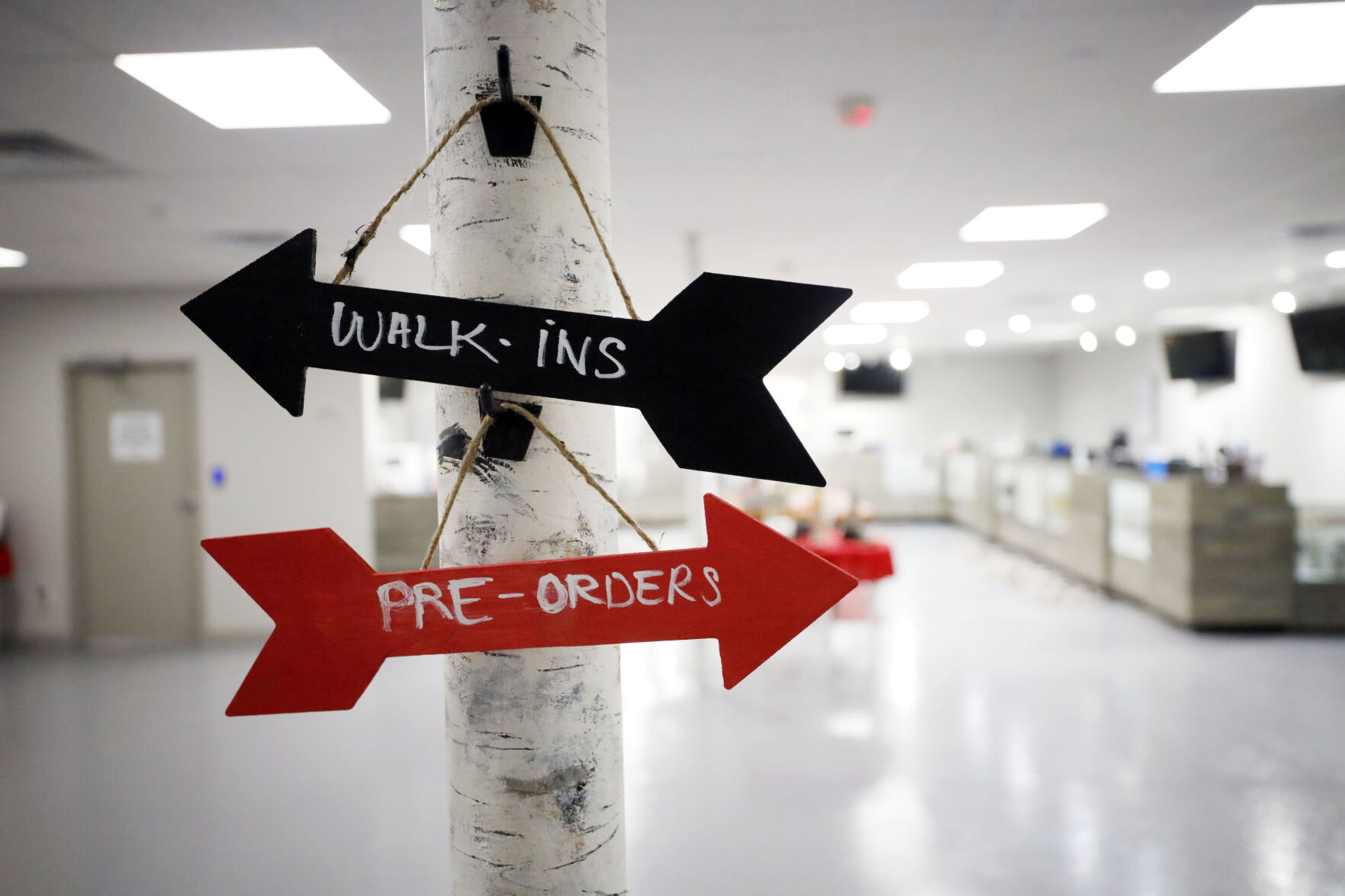 arrow signs for walk-ins and pre-orders at dispensary (copy)